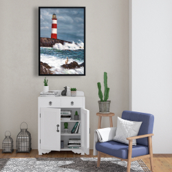 Framed 24 x 36 - Lighthouse at the edge of the sea unleashed