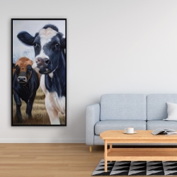 Framed 24 x 48 - Two cows eating grass
