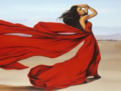 Woman with a long red dress in the desert