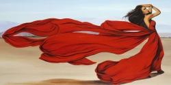 Woman with a long red dress in the desert