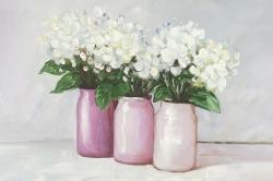 Fleurs d'hortensia dans des vases roses