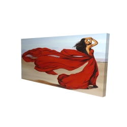 Woman with a long red dress in the desert