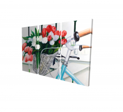 Bicyclette avec panier de tulipes